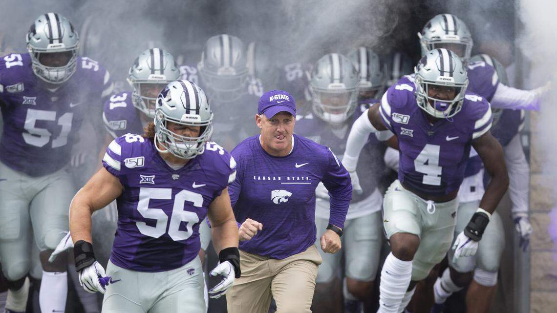 Kansas State football coach Chris Klieman leads his team onto the field before their game against Nicholls State in 2019 at Bill Snyder Family Stadium.