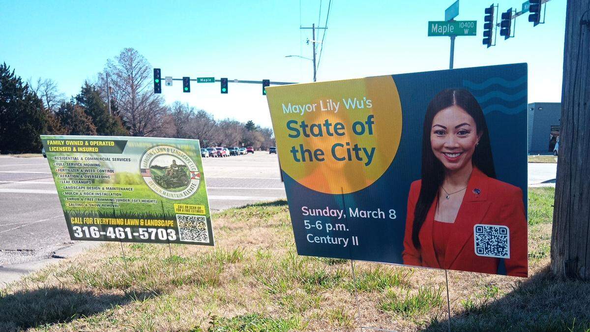 A yard sign promoting Lily Wu’s State of the State speech, next to a sign promoting a lawn care company, at the corner of Maize and Maple last weekend.