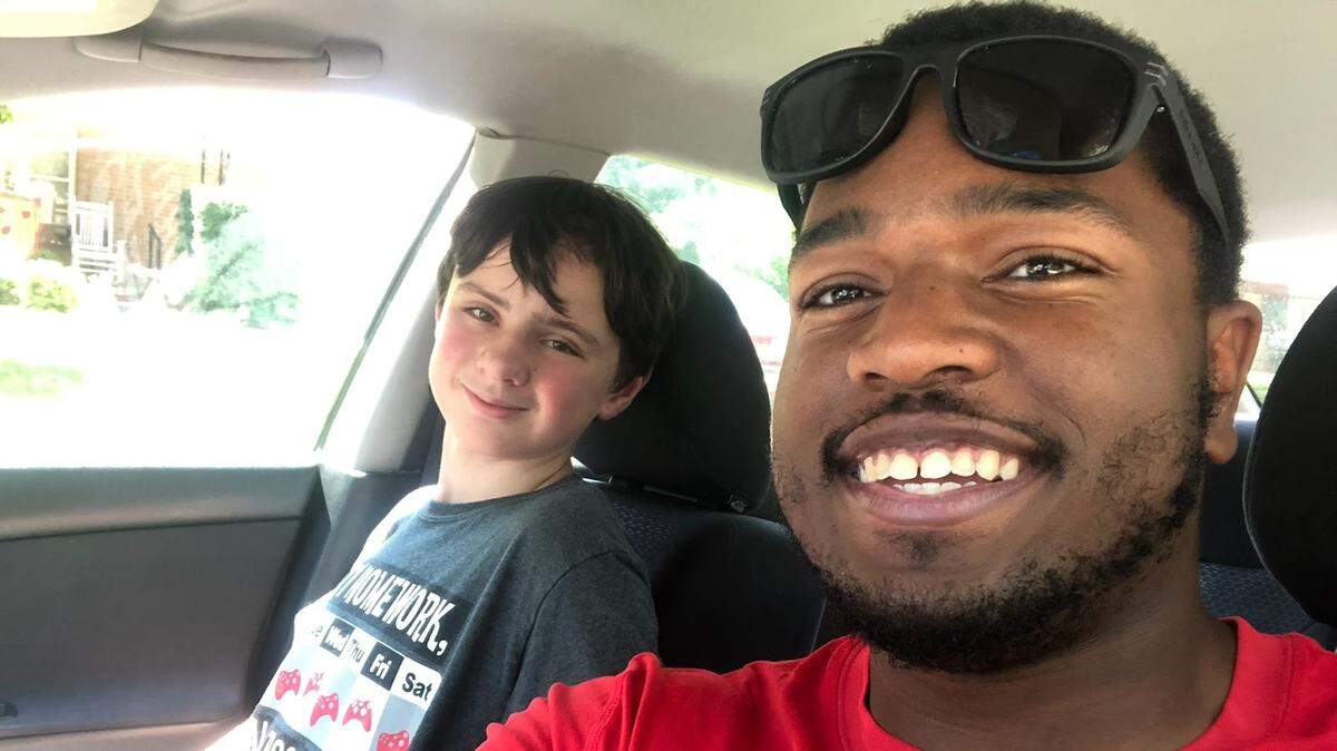 Zackery Willis (right), a senior football player at Friends University, has formed a friendship with Kamerynn through the Big Brothers Big Sisters mentorship program in Wichita.