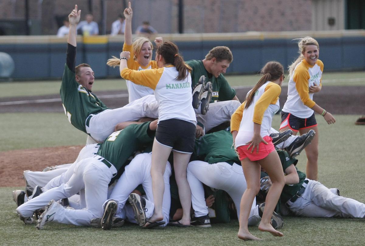 The Bishop Carroll baseball team celebrates after beating Blue Valley 4-3 to win the class 5A state baseball title on Saturday at Eck Stadium. (May 26, 2012)
