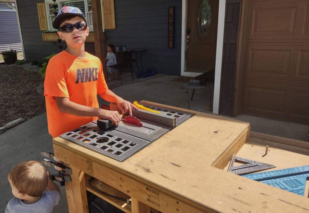 An older photo of Silas Eichbauer when he was doing work alongside his father.