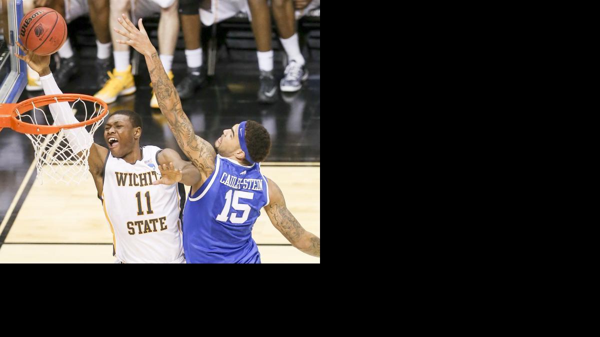 Wichita State's Cleanthony Early drives to the basket for two against Kentucky's Wille Cauley-Stein late in their third round game at the NCAA Tournament. The game has been selected by multiple sites at the top game of the 2014 Tournament.

