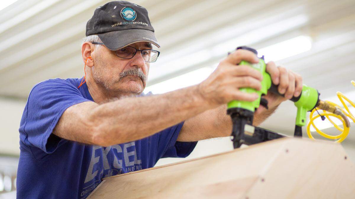 Volunteer Harlan Bartel assembles a corner piece of a cabinet set for the Kansas unit of the Mennonite Disaster Service. MDS is a non-profit organization dedicated to rebuilding communities after disaster or helping those in need.