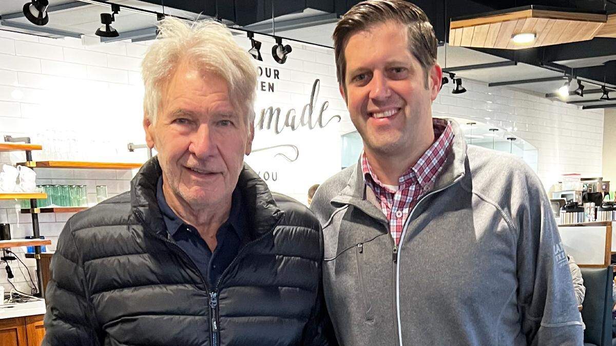 The staff at the downtown HomeGrown didn’t get a picture with Harrison Ford during his two visits this week, but he’s pictured here with owner Jon Rolph in 2023.