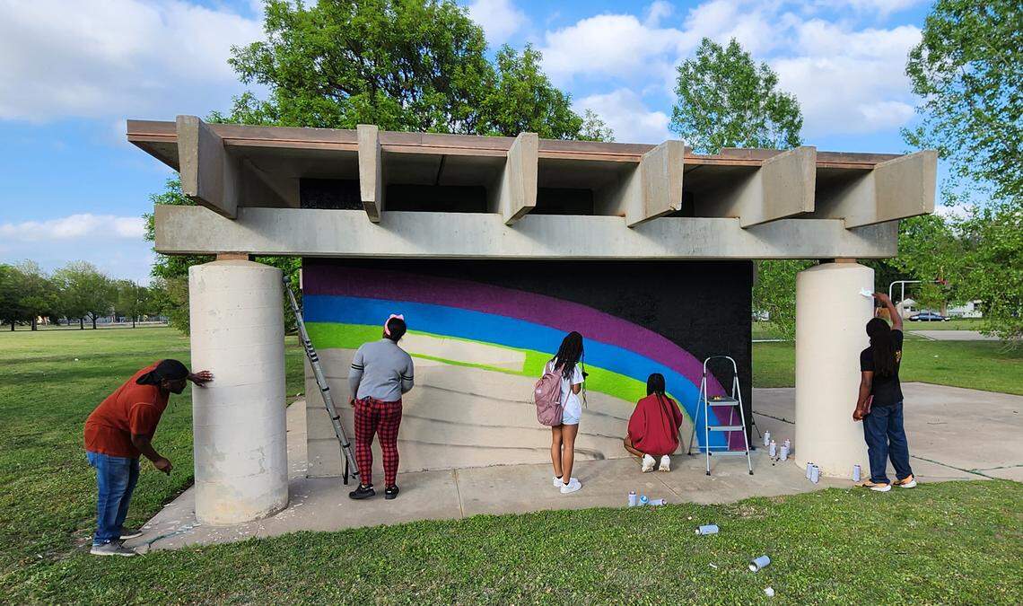 Several teens were selected through the new Meet the Challenge program to work on murals at Murdock Park at Ninth and Minnesota. They first discussed how art can help change narratives.