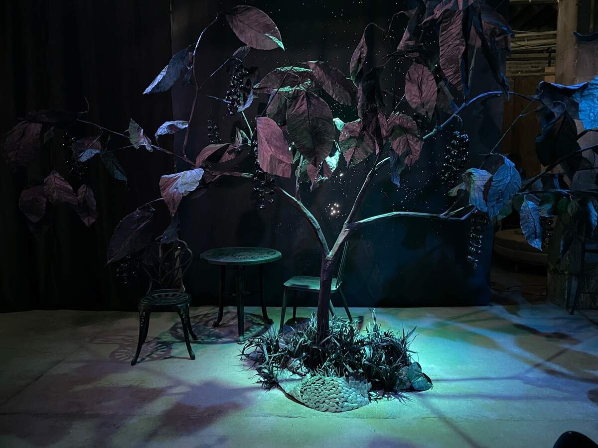 For “The Midnight Garden Coffee Shop” at the Fisch Haus, Meghan Miller invites visitors to relax over a cup of coffee in a fantastical environment filled with paper blooms and foliage that mimic common Kansas flora.