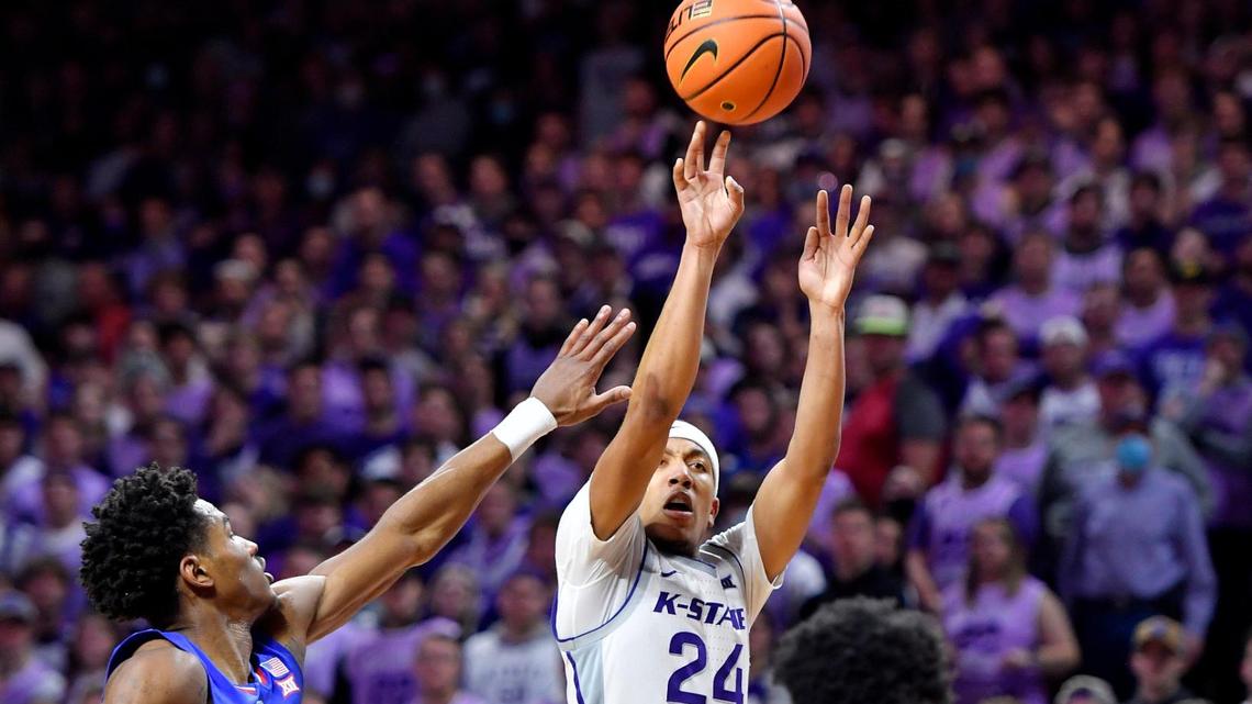 K-State’s Nijel Pack shoots over KU’s Ochai Agbaji and David McCormack during the first half of Saturday’s Big 12 Conference game at Bramlage Coliseum. Pack had 22 points in the opening half.