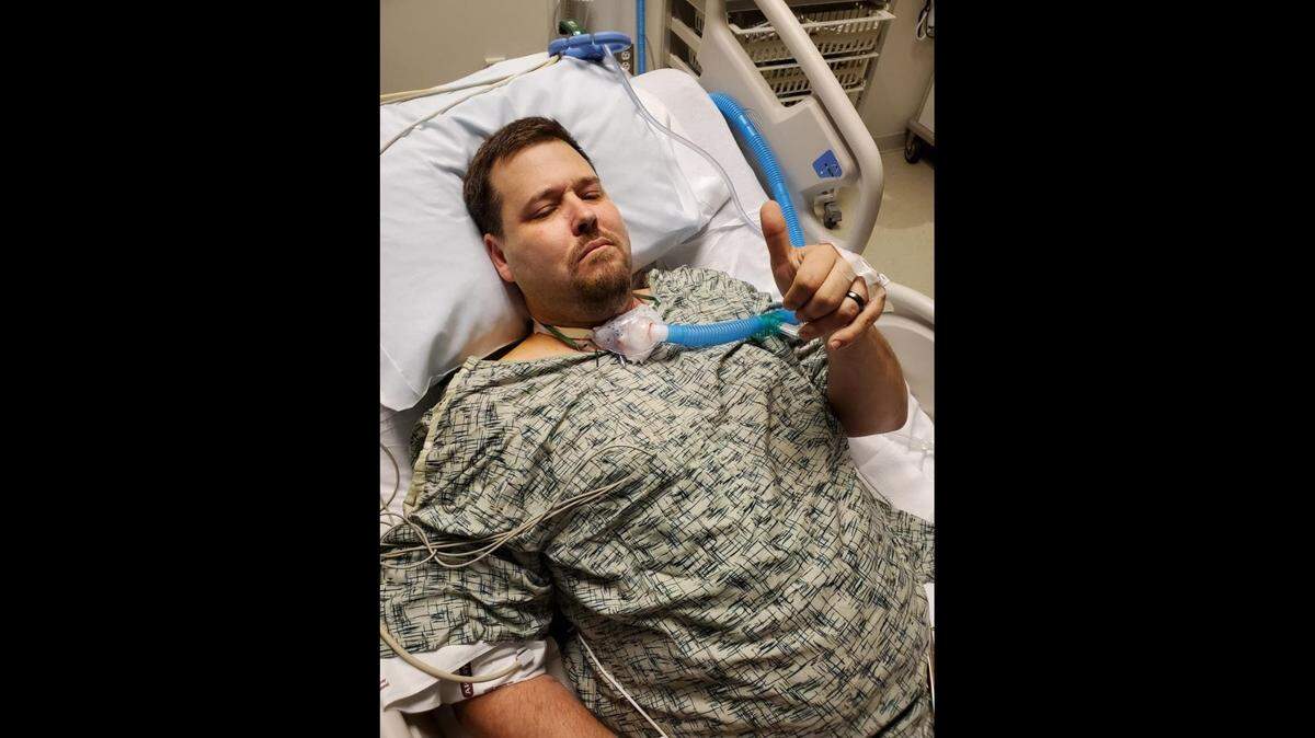Anil Gharmalkar of Oswego after having a tracheotomy. Gharmalkar said the inflammation from COVID-19 and the irritation from a ventilator tube resting on his throat caused him to need the procedure.