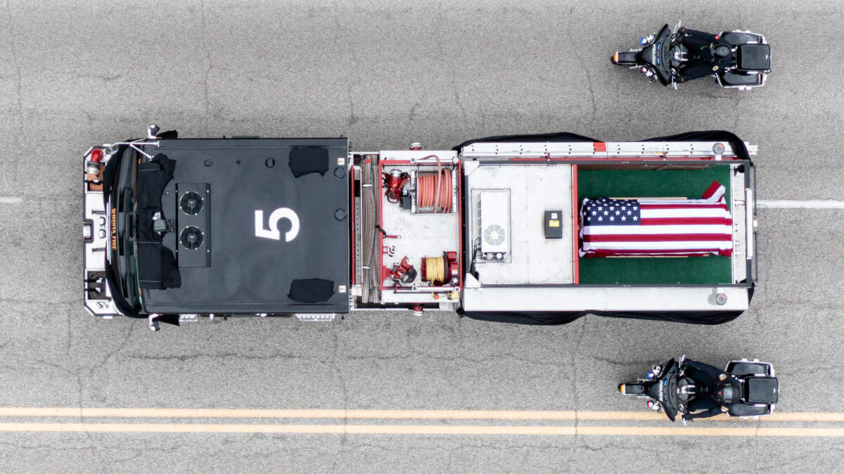 The body of Wichita firefighter Ty Voth is transported to the cemetery in Whitewater after his funeral at Park City Arena on Friday. Voth died on August 1 after collapsing while fighting a house fire near Haysville.