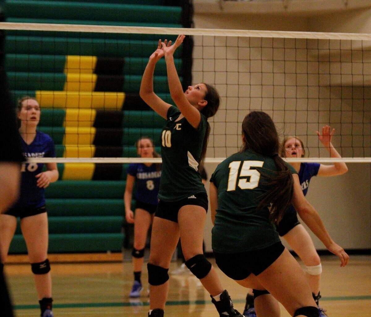 Carroll senior setter Rebecca Hageman sets the ball during the Golden Eagles’ triangular with Kapaun Mt. Carmel and Wichita East on Tuesday. (Sept. 4, 2018)