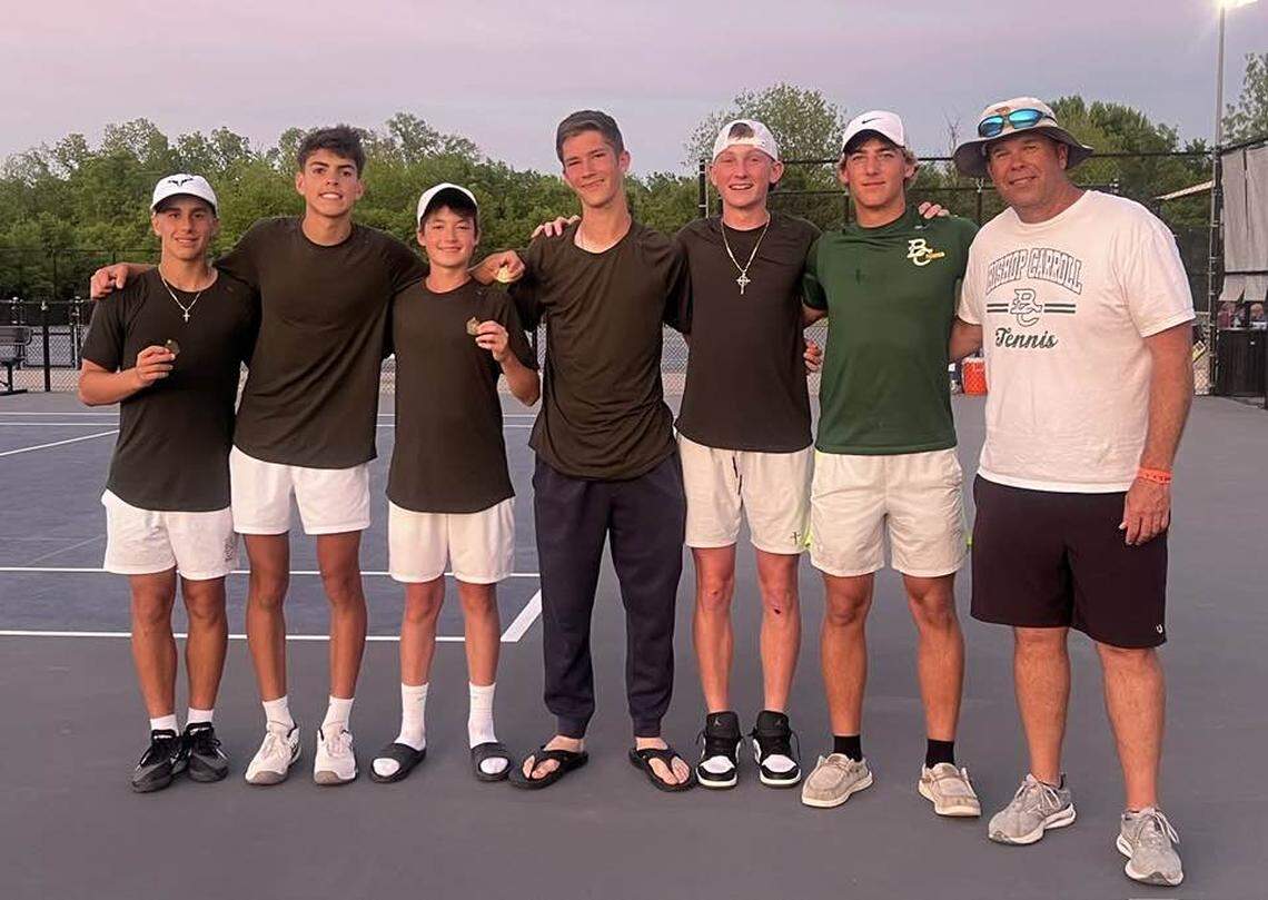 The Bishop Carroll boys tennis team pose for a picture following the Class 5A regional hosted by Arkansas City. Freshman Brandon Steven won the medalist honors in singles.