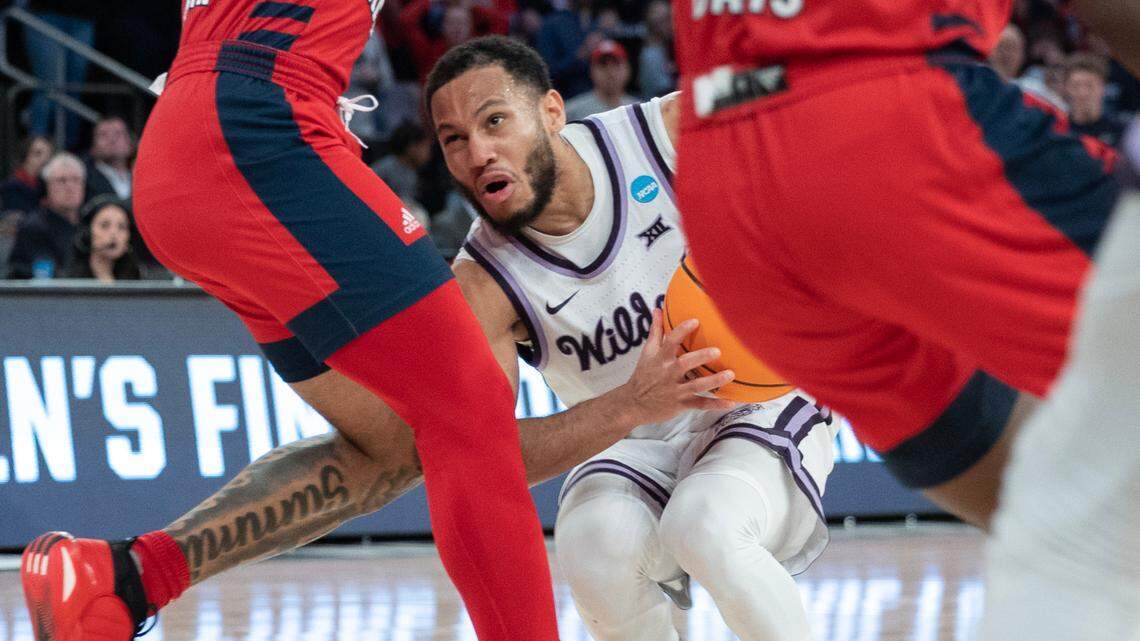 Kansas State’s Markquis Nowell runs into a wall of Florida Atlantic defenders during the second half of the East Regional final at Madison Square Garden on Saturday night.