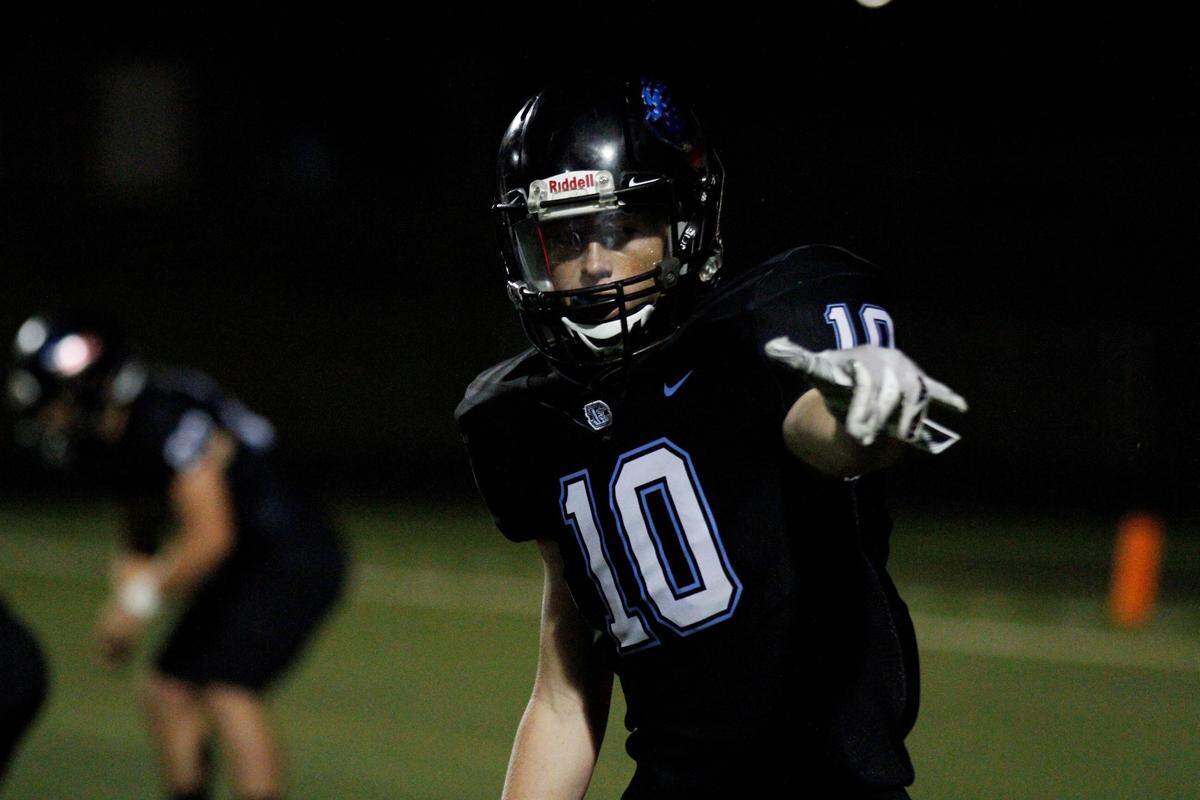 Goddard Eisenhower sophomore receiver Cody Hauser lines up with the referee during the Tigers’ 30-22 loss to Andover on Thursday night. (Sept. 13, 2018)