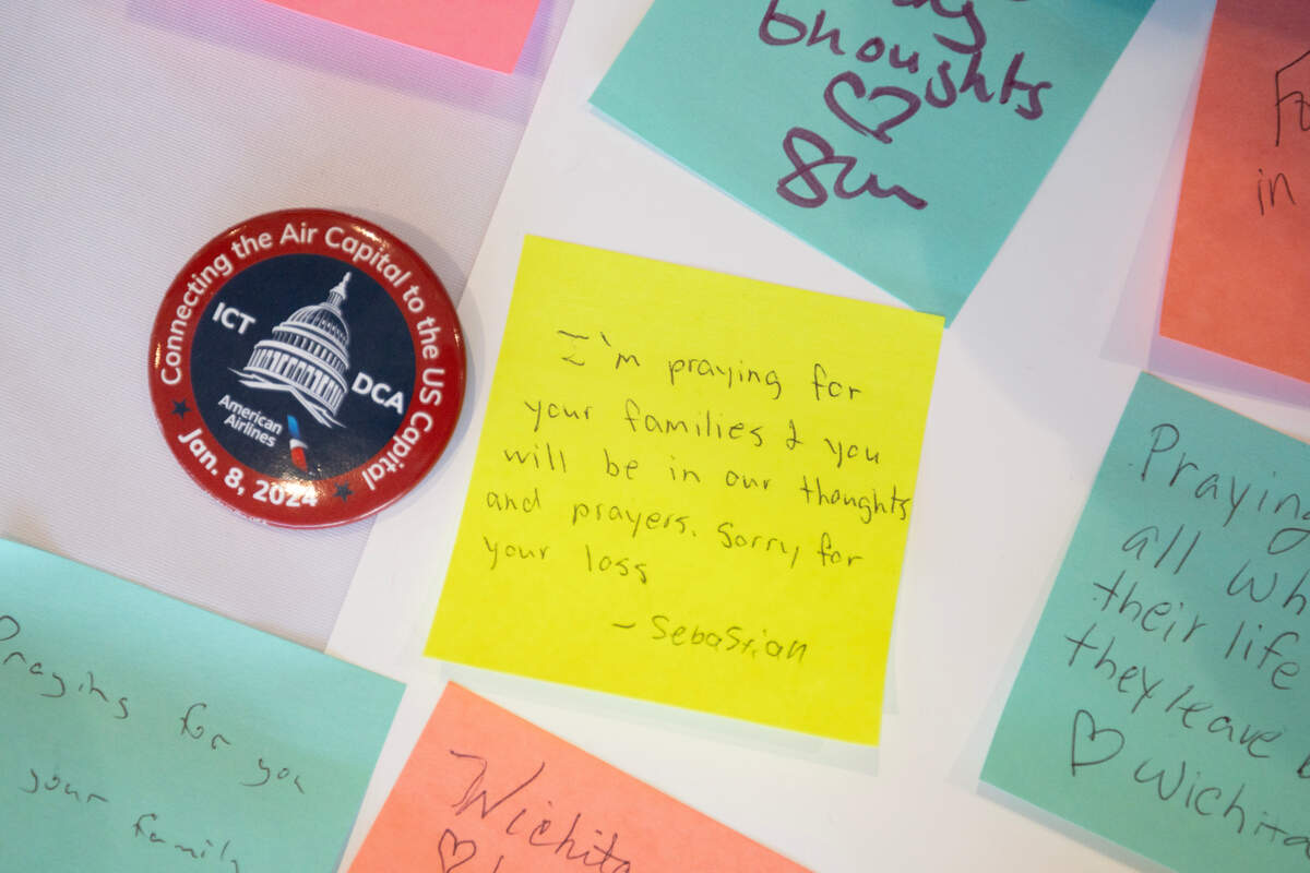 A table at Wichita’s Eisenhower Airport has been set up for people to leave messages of condolence for the crash victims.