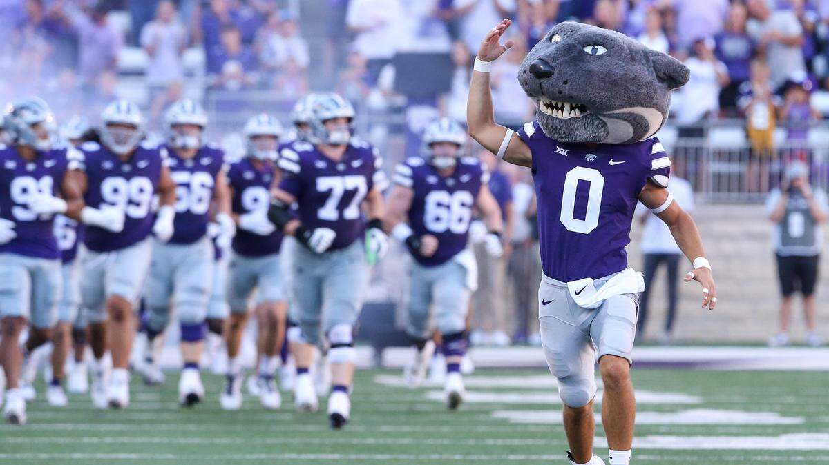 Kansas State Wildcats mascot Willie Wildcat leads the team onto the field before the start of a game against the Tennessee-Martin Skyhawks at Bill Snyder Family Football Stadium.