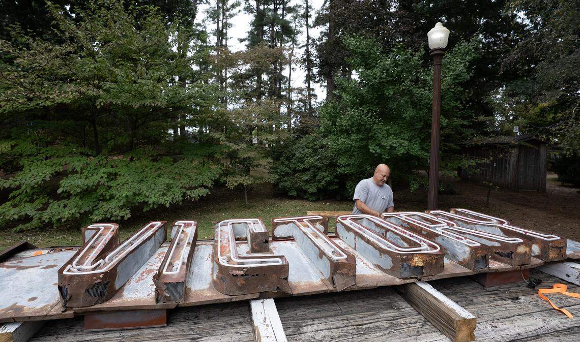 Mike Martin with Nu-Line Signs restored the old Victory Theater sign and recently installed it over the Loblolly performance stage at the Bartlett Arboretum.