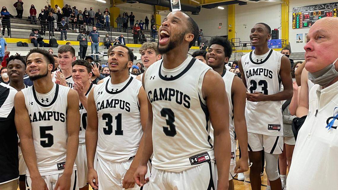 Campus senior Sterling Chapman and his teammates celebrate their second straight Class 6A sub-state championship following a 77-53 victory over Derby on Friday.