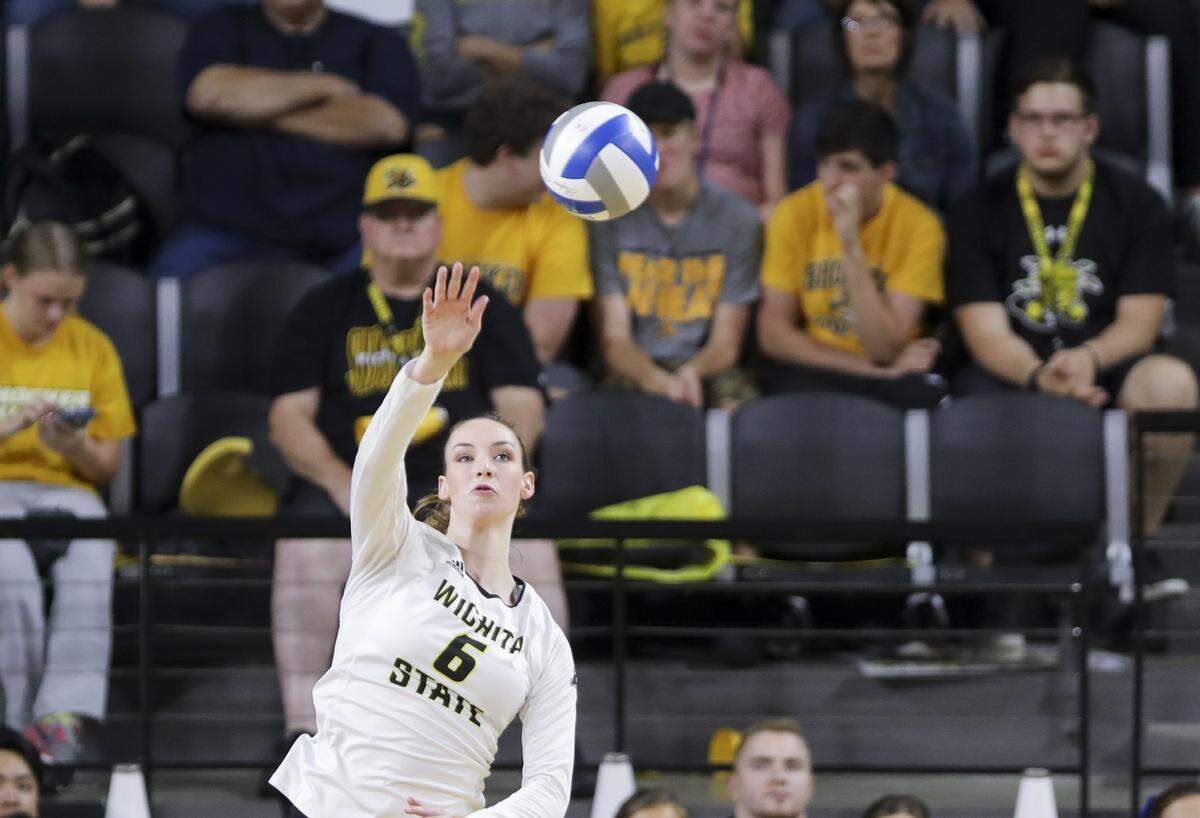Wichita State middle blocker Emma Wright serves the ball against the Tulane Green Wave during the home-opener in Koch Arena. (Sept. 21, 2018)