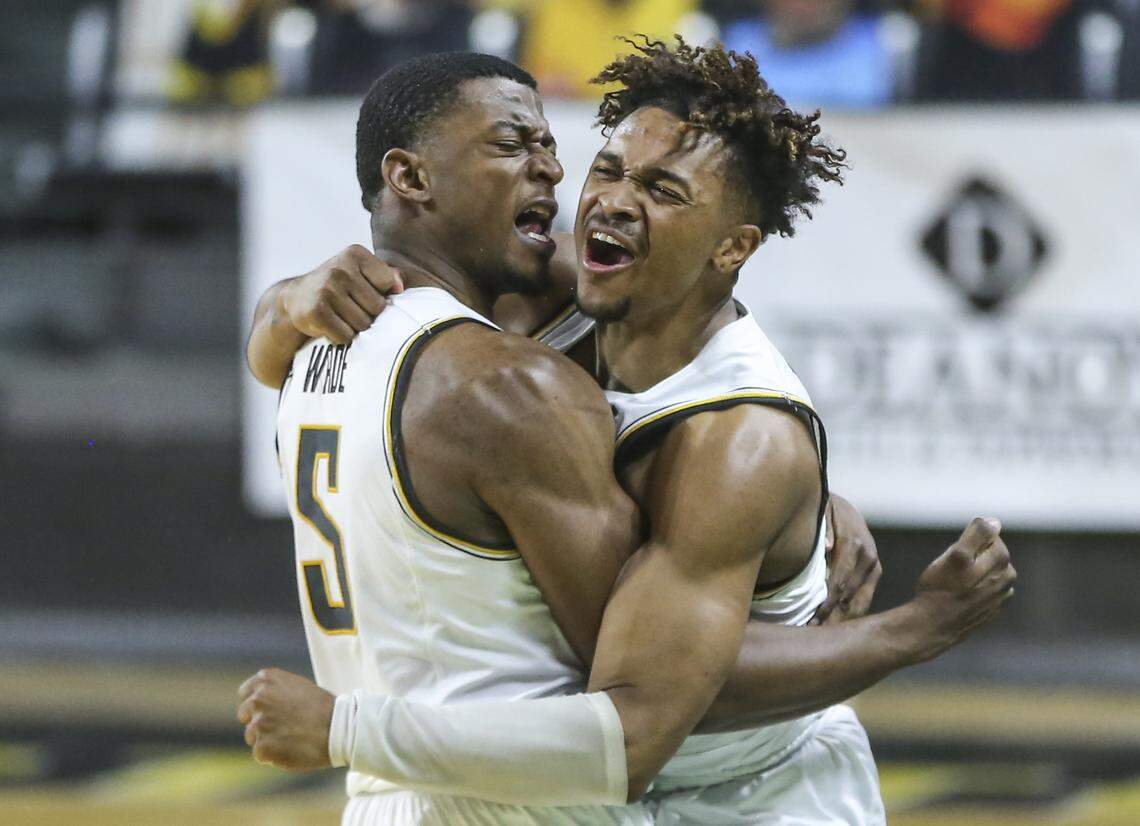 Wichita State’s Trey Wade, left, and Tyson Etienne celebrate after the Shockers took down conference leader Houston 68-63.