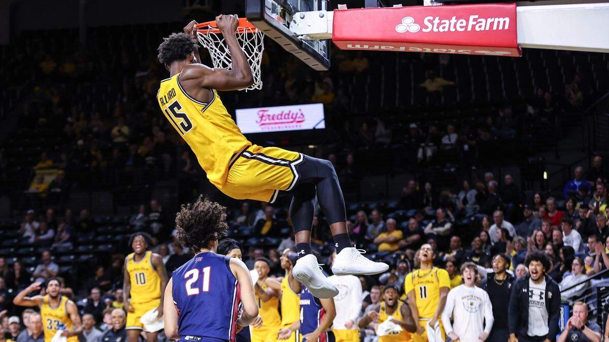 Wichita State newcomer Quincy Ballard slam dunks the ball in the Shockers’ exhibition game victory over Newman last Wednesday.