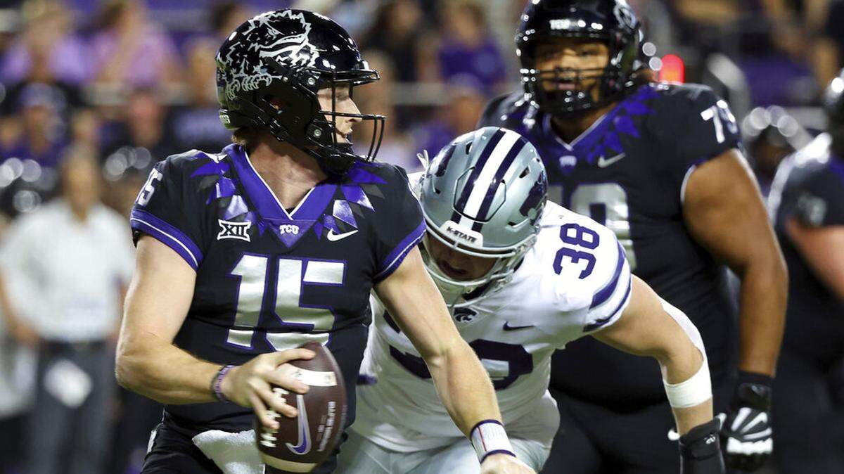 TCU quarterback Max Duggan (15) looks to pass as he is pursued by Kansas State defensive end Brendan Mott (38) during the first half of an NCAA college football game Saturday, Oct. 22, 2022, in Fort Worth, Texas. (AP Photo/Richard W. Rodriguez)