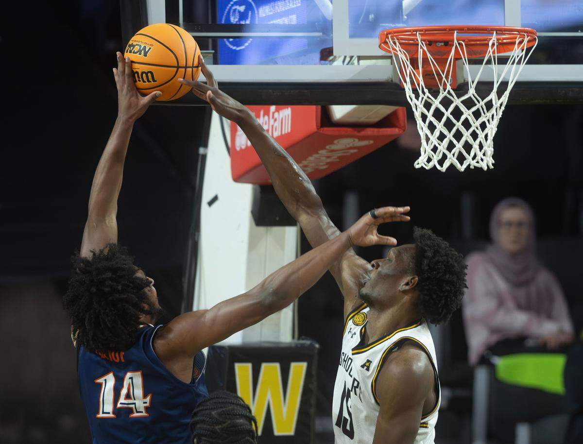 Wichita State’s Quincy Ballard blocks the shot of UTSA’s Massal Diouf in the second half of Wednesday night’s game.