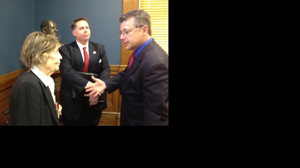 Candidate John Whitmer, center, with his mother, Flora Nessly, and attorney Richard Macias after the State Objections Board rejected a challenge to his residency and allowed him to stay on the Aug. 5 primary ballot. Whitmer is challenging Rep. Joe Edwards in the Republican primary in state House District 93.

