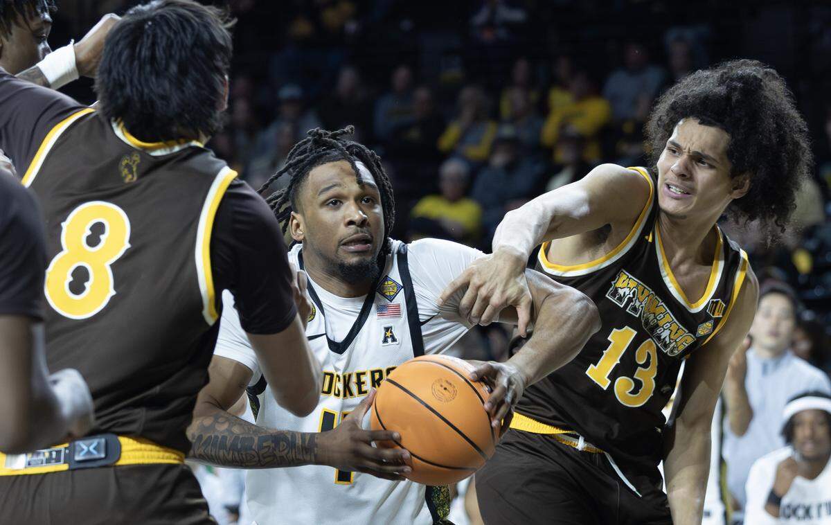 Wichita State’s TJ Williams secures a rebound during the second half of their NIT first round game against Wyoming on Tuesday night at Koch Arena.