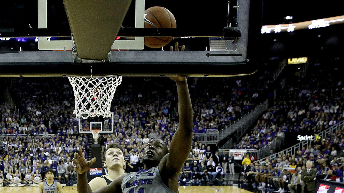 Kansas State’s Makol Mawien (14) puts up a shot during the first half of an NCAA college basketball game against Vanderbilt Saturday, Dec. 22, 2018, at the Sprint Center in Kansas City, Mo. (AP Photo/Charlie Riedel)
