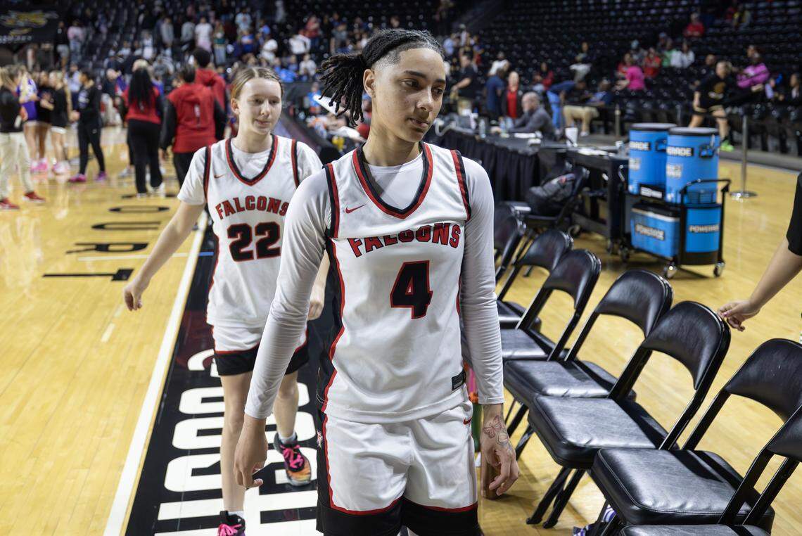 Wichita Heights’ player Aniyah Harris walks off the court after the top-seeded Falcons lost to No. 8 seed Blue Valley Northwest on Tuesday at the quarterfinals of the 6A basketball tournament at Koch Arena.