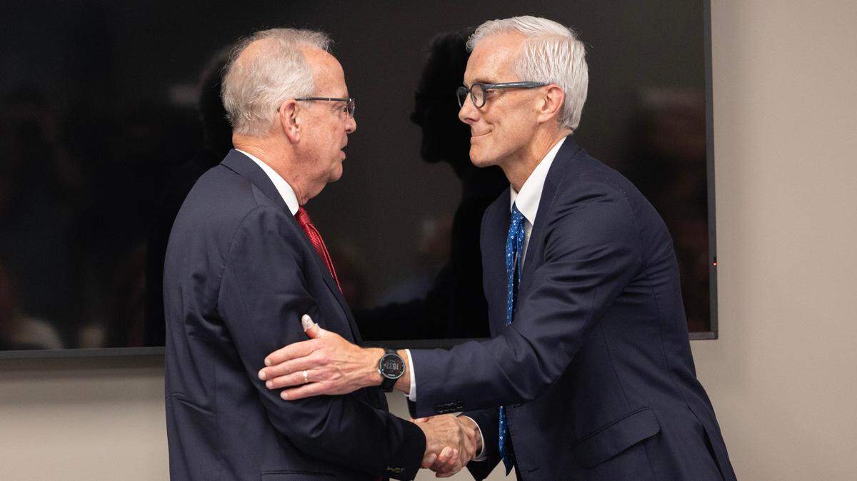 Sen. Jerry Moran, left, shakes hands with Secretary of Veterans Affairs Denis McDonough after both men spoke at a ribbon cutting ceremony at the new Wichita VA Regional Benefits Office on east Douglas.