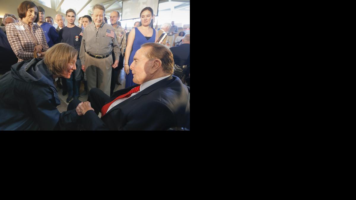 Former Sen. Bob Dole, right, is greeted by Keri Meinking during an event at the Dole Institute of Politics in Lawrence on Tuesday. Dole, 90, made a return trip to Kansas this week to thank people from across the state for their support during his years serving the state in Washington, D.C.

