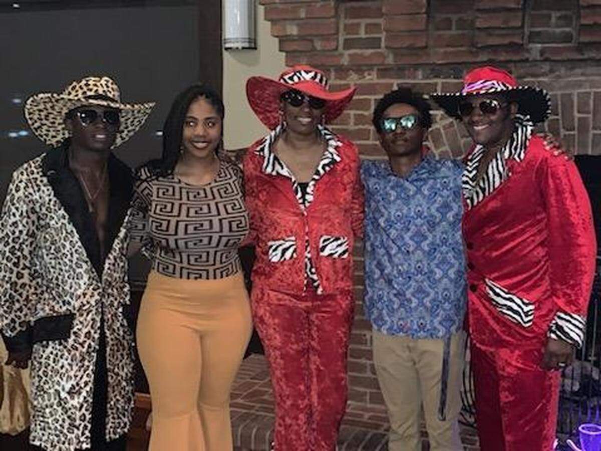 From left: Zachary Miller poses for a photo with his half-sister, Bre’Onna Searles, stepmother, Rosa Fernanders, half-brother Gabe Fernanders and father Randy Fernanders. Miller was killed Nov. 10 at a north Wichita bar.