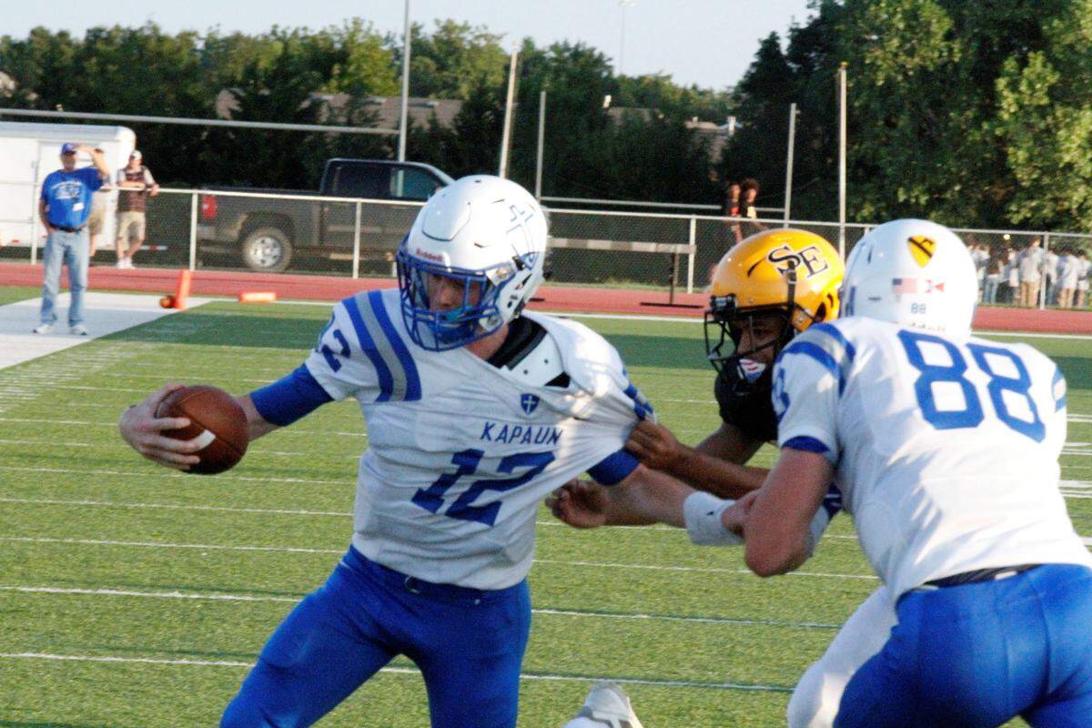 Kapaun senior quarterback Jack Hacking reaches for the goal line in the Crusaders’ 26-3 victory against Wichita Southeast on Thursday.
