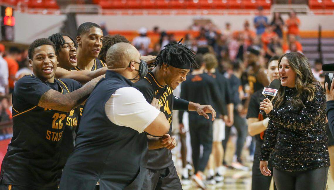 Wichita State’s Ricky Council IV is mobbed by teammates and coaches while being interviewed on ESPN after his big second half in the Shockers’ win at Oklahoma State.