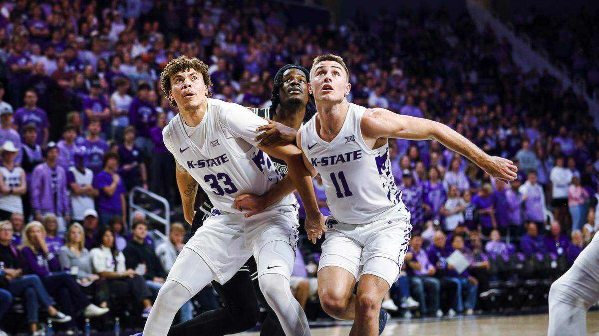 Kansas State basketball players Coleman Hawkins and Brendan Hausen compete for a rebound.