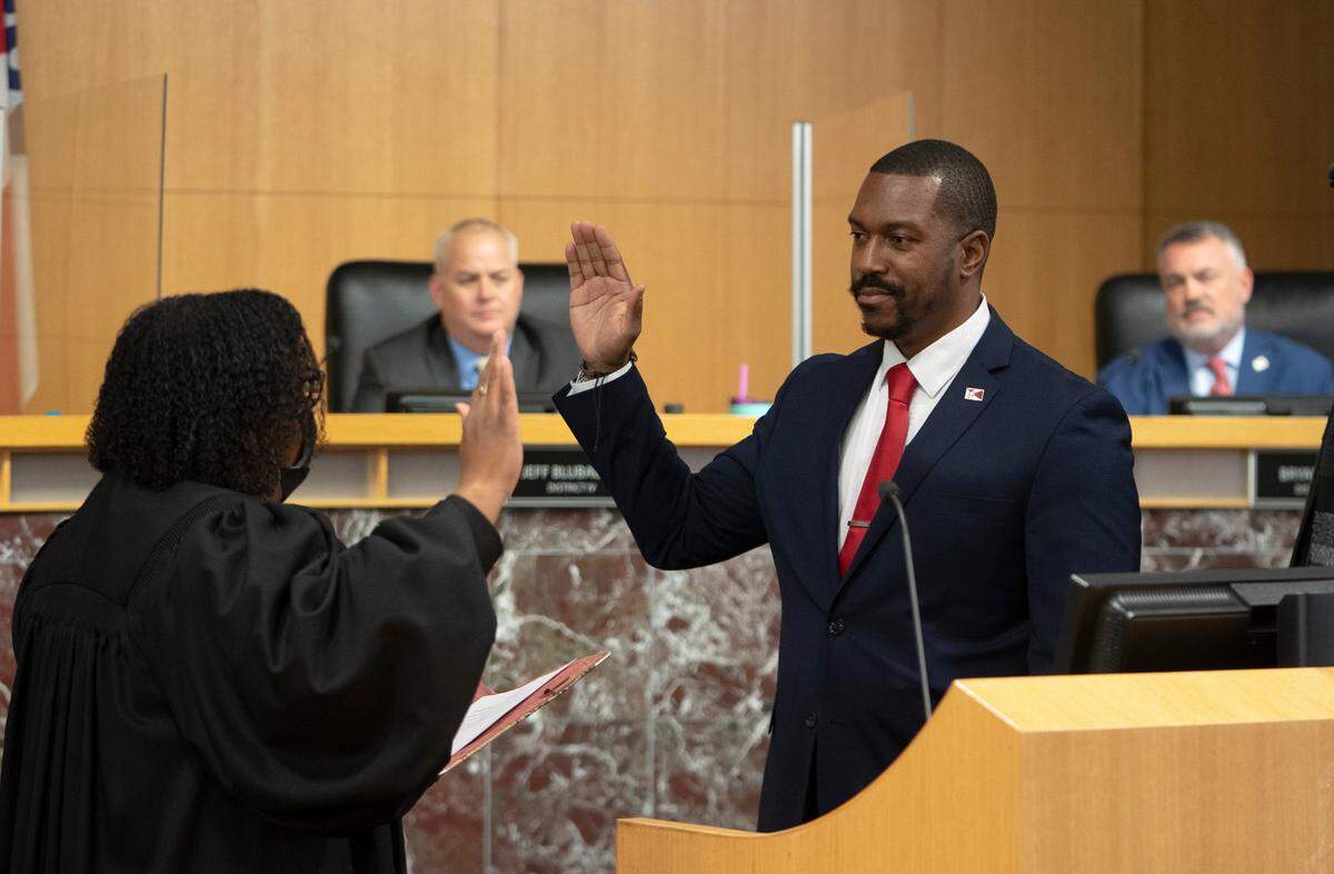 Wichita City Council member Brandon Johnson is sworn into office by Judge Jennifer Jones. (January 10, 2022)