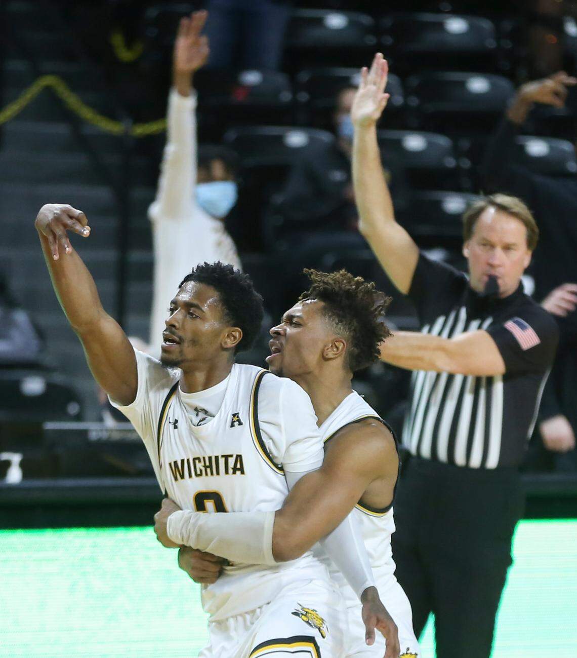 Wichita State players Alterique Gilbert, left, and Tyson Etienne celebrate after Gilbert hit a three-pointer during the second half against sixth-ranked Houston on Thursday.