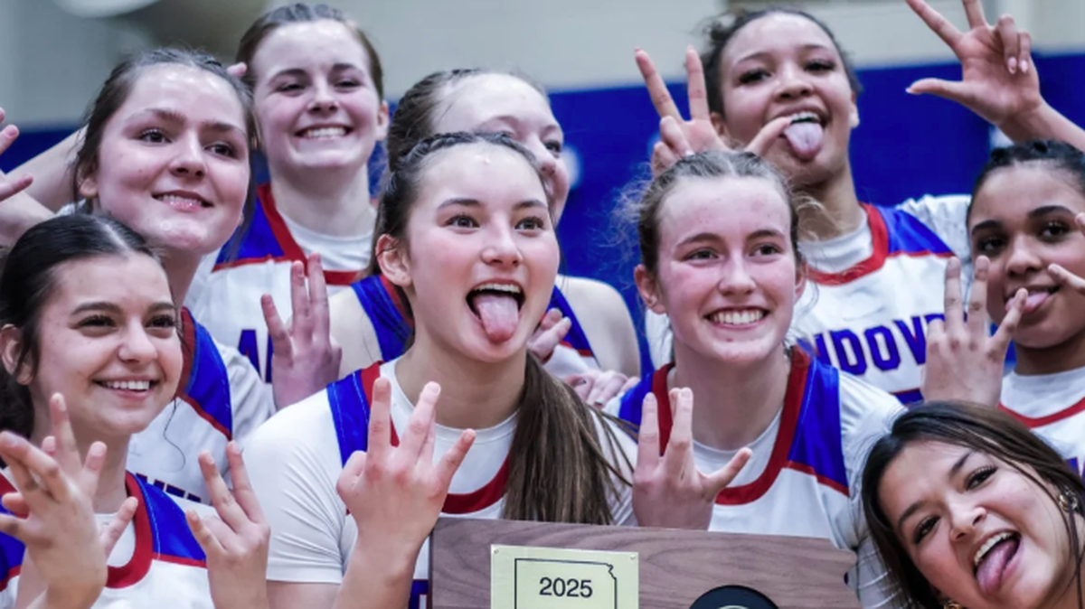 The Andover girls basketball team celebrates after winning a sub-state championship to advance to the Class 5A tournament.
