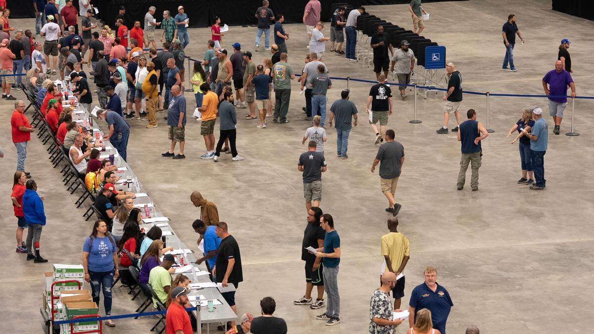 Striking International Association of Machinists and Aerospace Workers union members vote on a contract proposal with Spirit AeroSystems inside Hartman Arena on June 29, 2023. Union leadership has said it strongly recommends approval of the new proposal, which preserves existing healthcare benefits, guarantees a 20% wage increase over four years and eliminates mandatory overtime work on weekends.