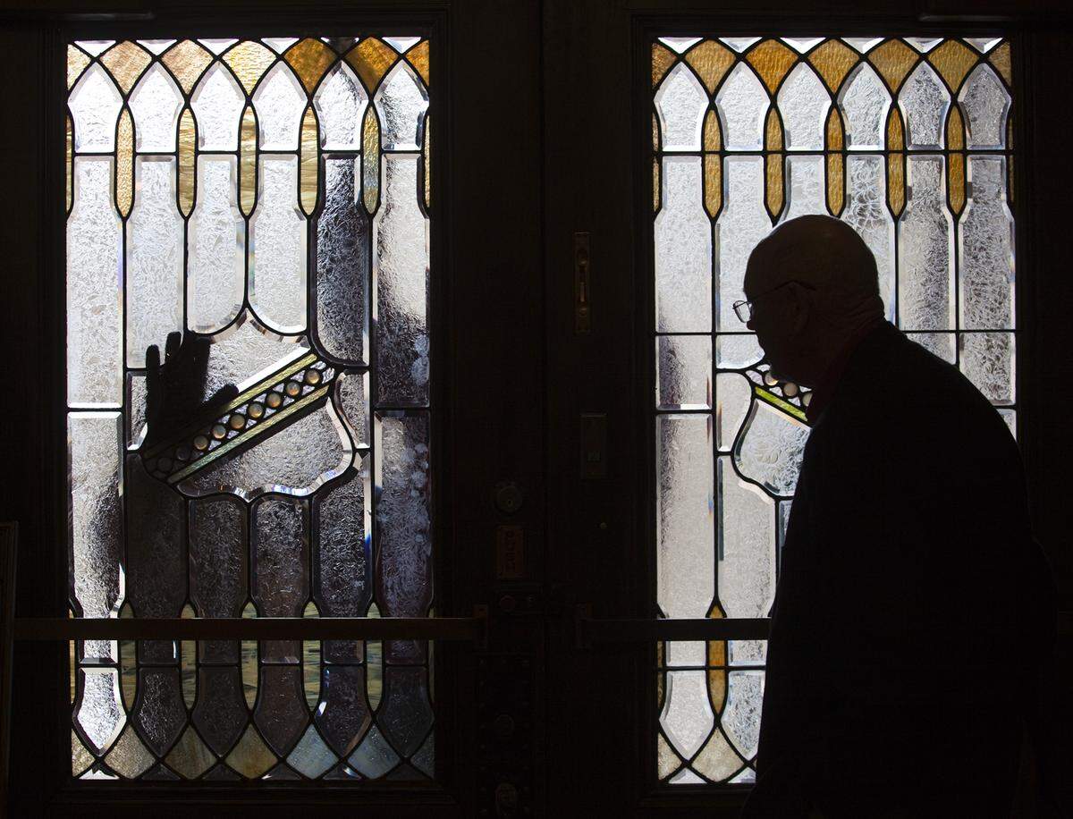 For only the second time since 1898, the Scottish Rite Center has sold, this time to Chase Koch’s Movement Musik. The Romanesque building was built for the YMCA between 1887 and 1888, and the Scottish Rite Freemasons purchased it in 1898. A worker repairs stained glass at the building in this file photo.