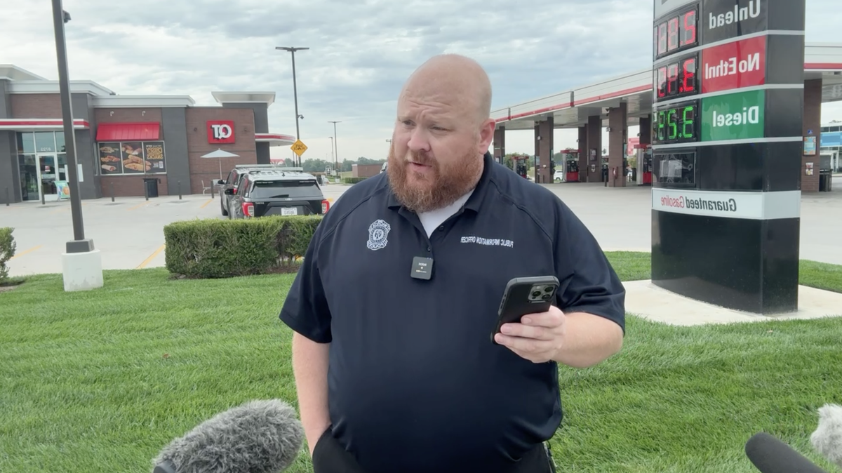 Wichita Police Officer Brad Wright gives a briefing about shots that were fired at a QuikTrip near Northwest High School after a Facebook Marketplace deal. No injuries.