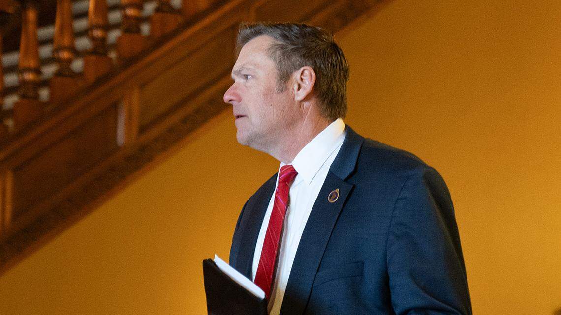 Kansas Attorney General Kris Kobach walks towards a press conference Thursday, Feb. 15, 2024 inside the Statehouse.