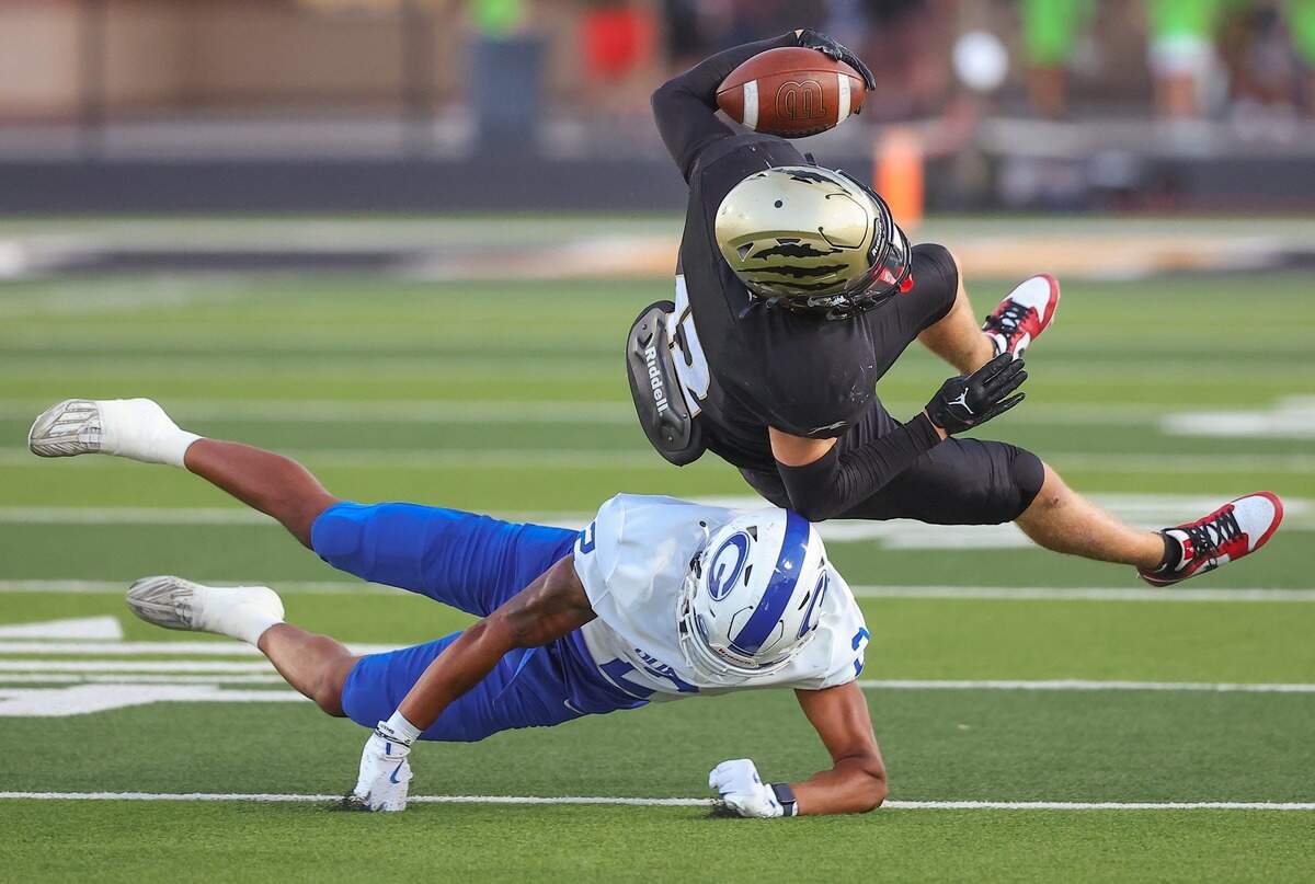 Goddard senior Jaden Cohens makes a tackle in the Lions’ 22-16 upset win over No. 1-ranked Andover Central on Friday.