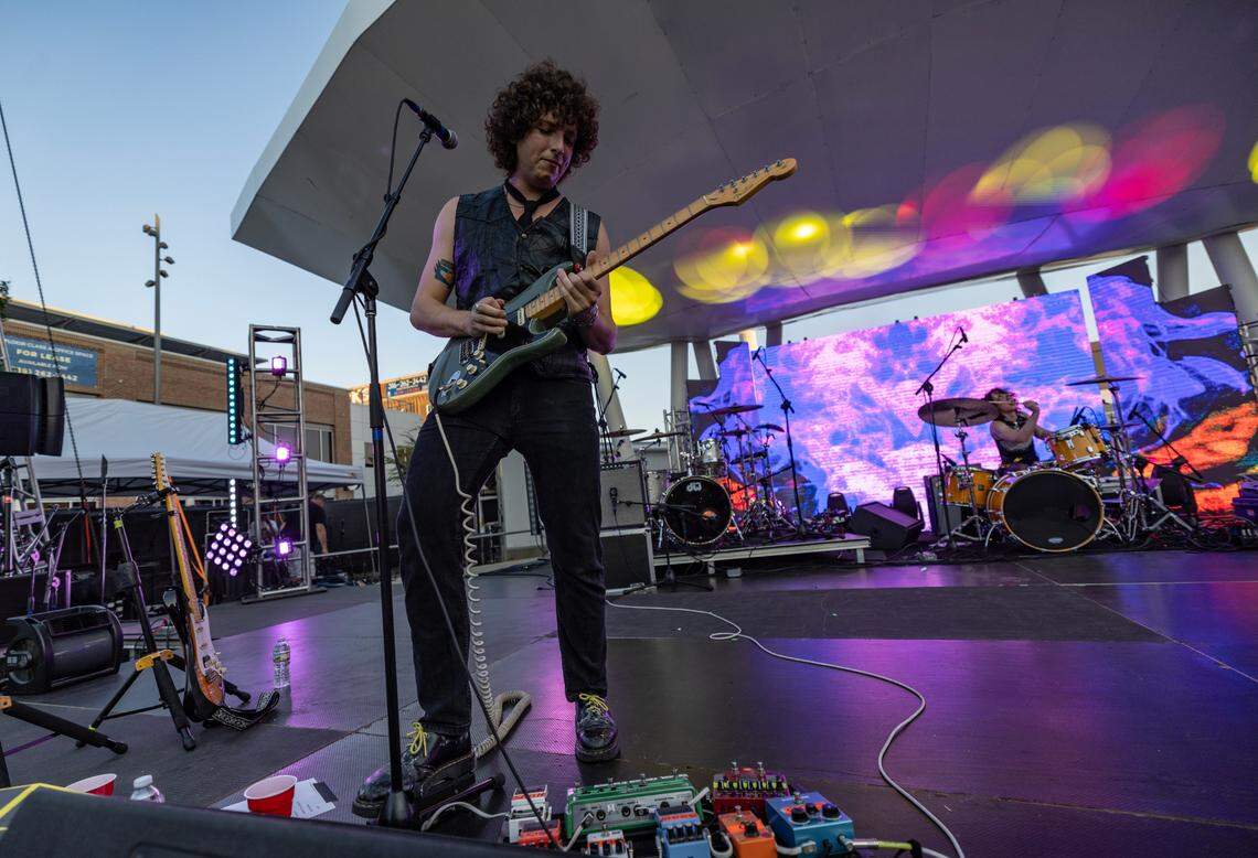 Guitarist Nick Kivlen of the band Sunflower Bean plays on the stage at Naftzger Park on Friday night during Elsewhere Fest.