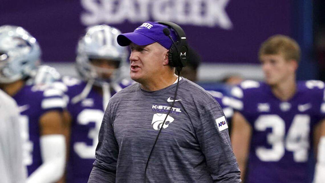 Kansas State head coach Chris Klieman instructs his team during time out in the first half of an NCAA college football game against Stanford in Arlington, Texas, Saturday, Sept. 4, 2021. (AP Photo/Tony Gutierrez)