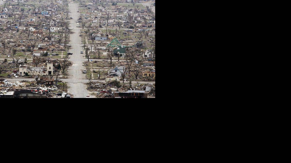 What is the EF Scale and how is it used to rate tornado intensity?