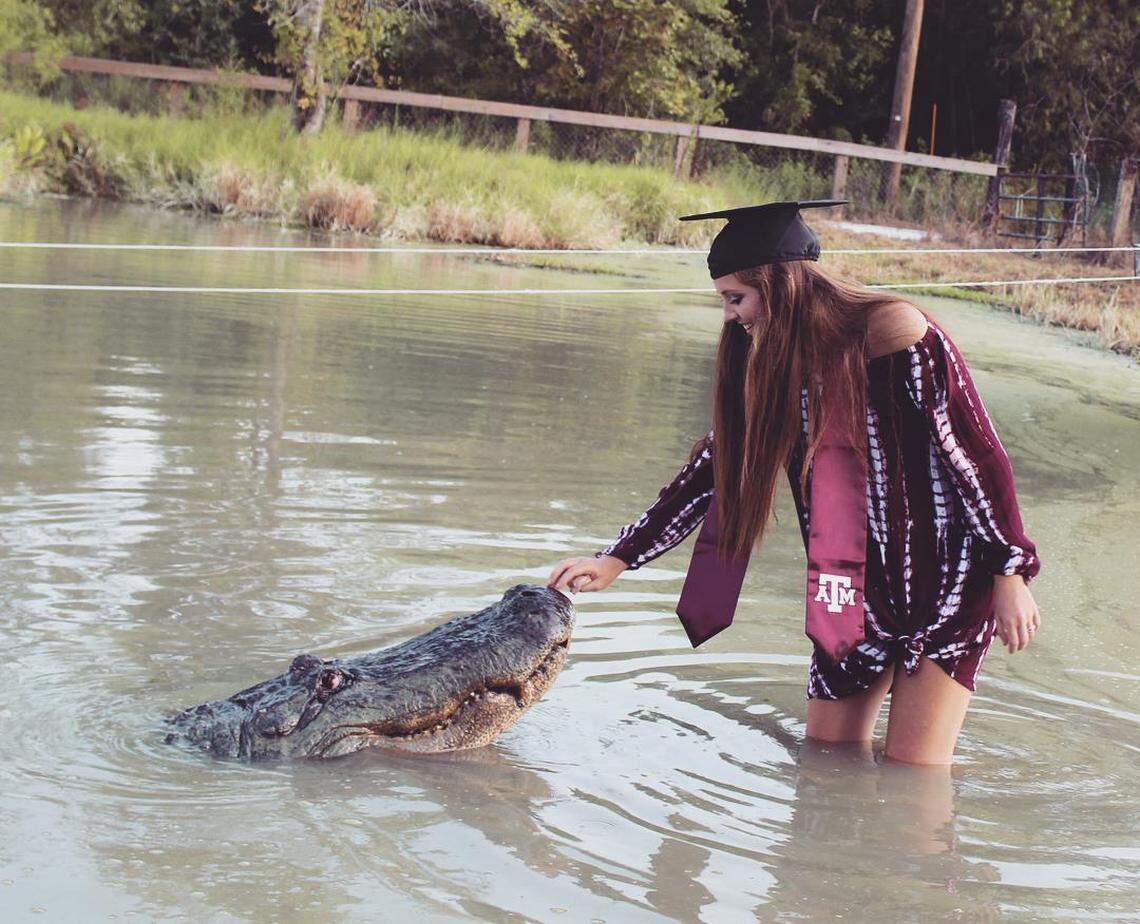 Makenzie Alexis Noland took her Texas A&M senior photos with Big Tex at Gator Country.