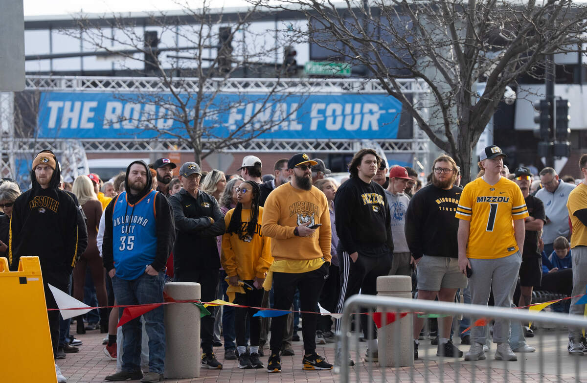 Folks line up to enter Intrust Bank Arena to watch the second set of two games in the first round of the 2025 NCAA Division I Men’s Basketball Championship