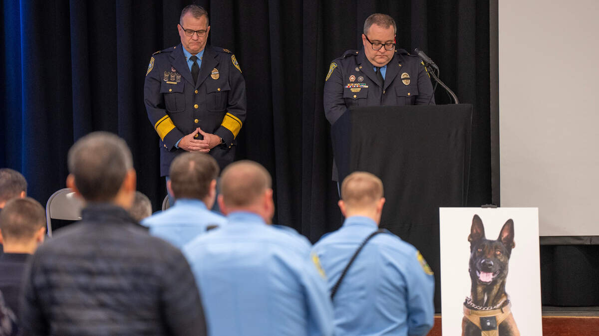 Sedgwick County Sheriff Jeff Easter, left, and Lt. Clayton Bush bow their heads during a moment of silence during a service Wednesday honoring fallen Sedgwick County Sheriff’s Office K-9 Bane. Bane was killed on Nov. 16, 2023, after he was sent into a drainage pipe in an effort to apprehend a suspect.